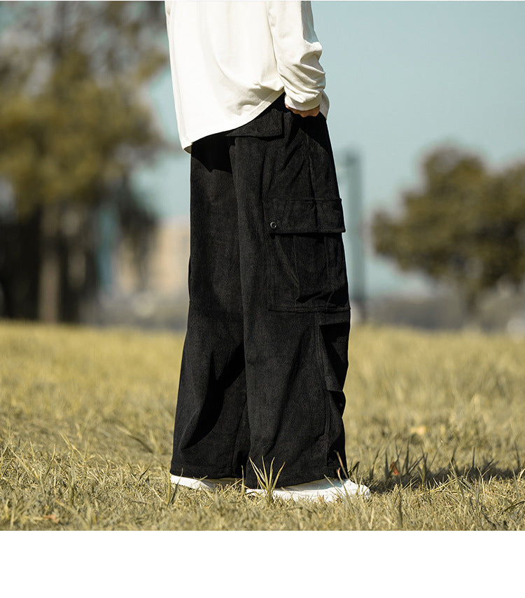 Black corduroy wide-leg cargo pants with flap pocket, side view