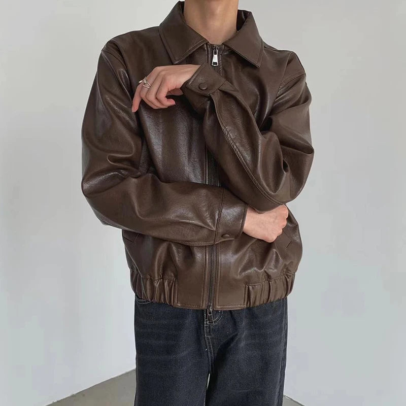 Brown faux leather jacket with snap cuff and gathered hem, front view