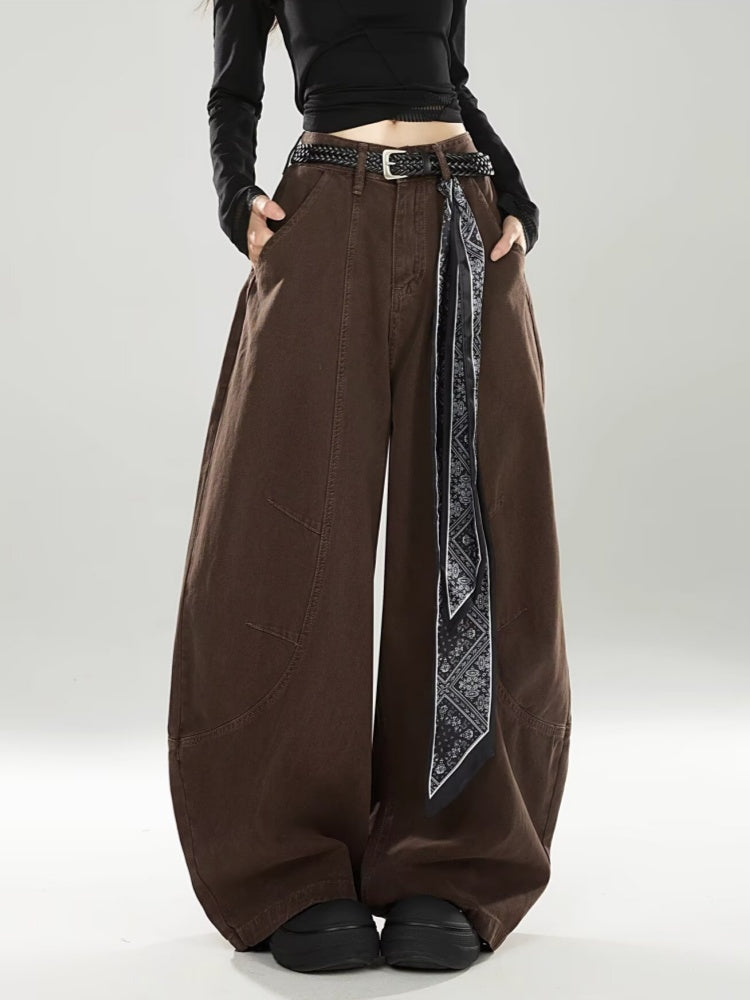 Chocolate brown barrel jeans styled with a braided belt and paisley scarf