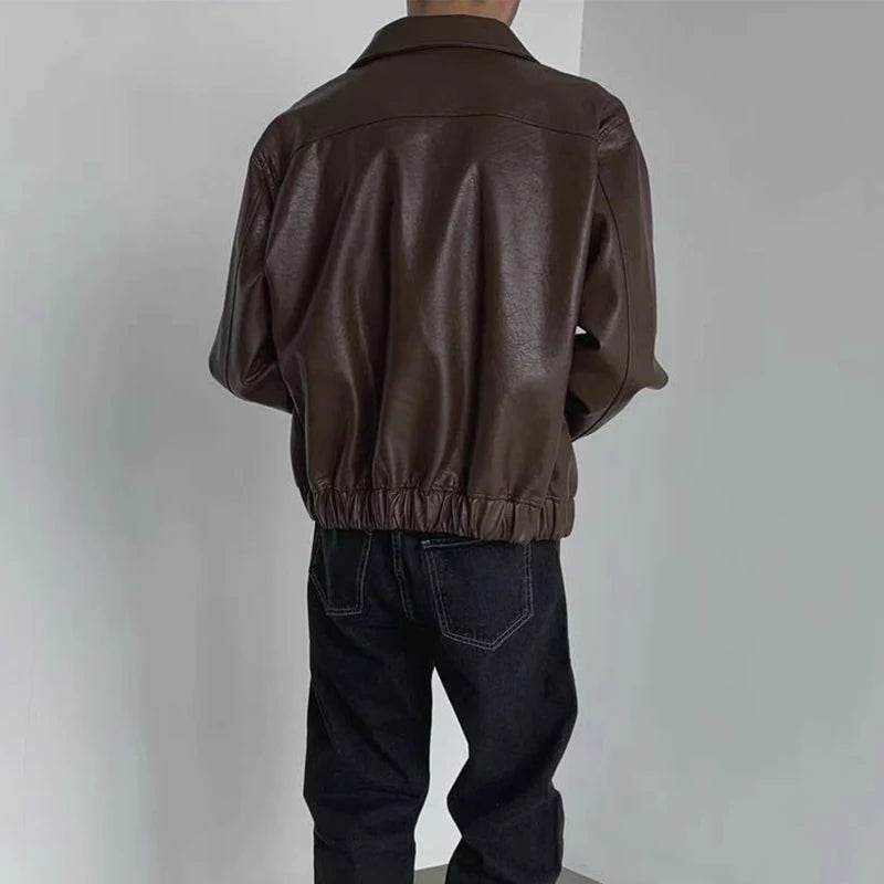 Back view of brown boxy faux leather jacket with elastic gathered hem