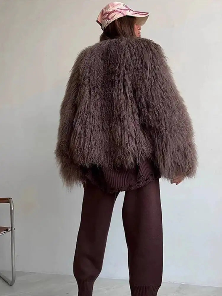 Back view of shaggy faux fur cropped jacket with wide sleeves