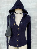 Navy hooded cable-knit button cardigan on a mannequin, front view