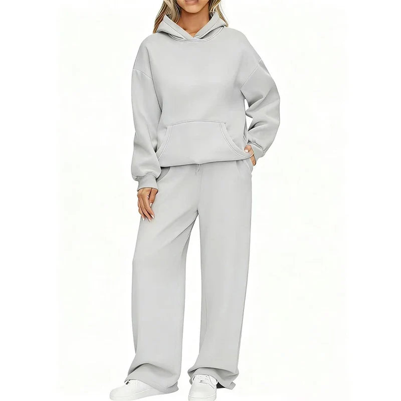 Model in light gray oversized hoodie and wide-leg sweatpants set, front view