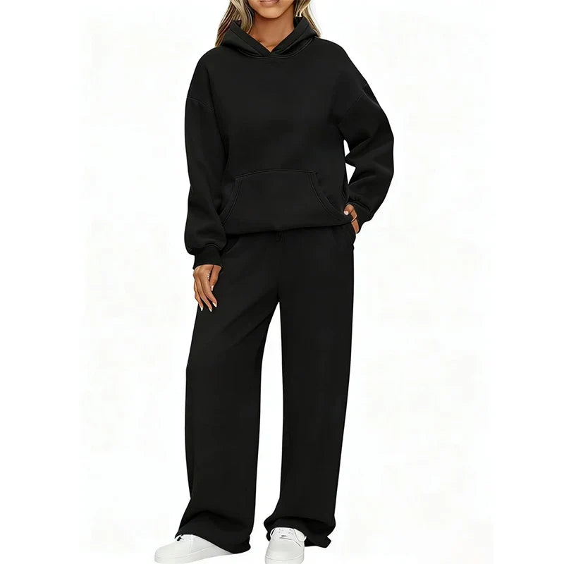 Model in black oversized hoodie and wide-leg sweatpants set, front view