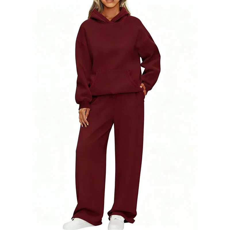 Model in burgundy oversized hoodie and wide-leg sweatpants set, front view
