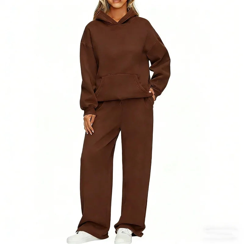 Model in chocolate brown oversized hoodie and wide-leg sweatpants set, front view