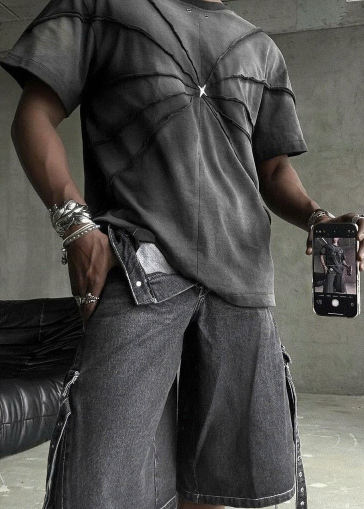 CARTWHEEL set featuring a black tie-dye top and cropped shorts with lace-up detail.